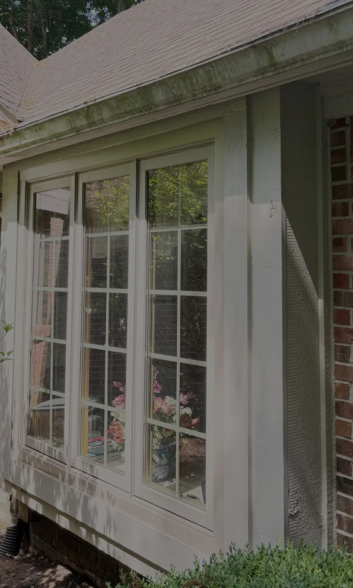 Three-pane bay window before cleaning